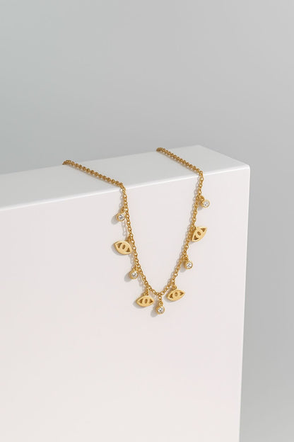 COLLAR -OJOS TURCOS DORADOS