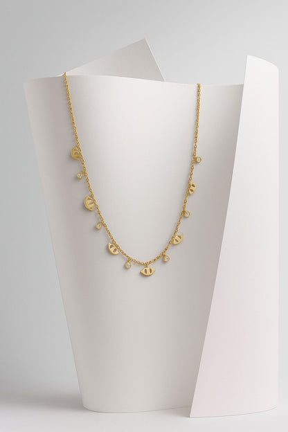 COLLAR -OJOS TURCOS DORADOS